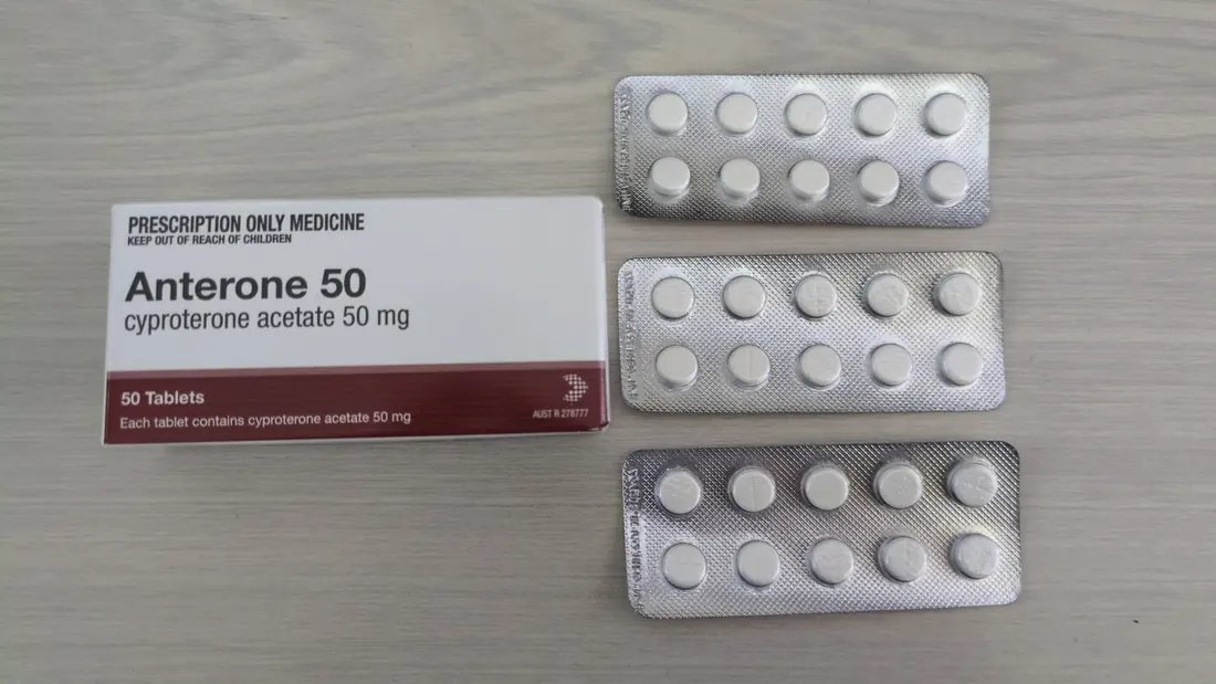 Blister packs of tablets beside their box