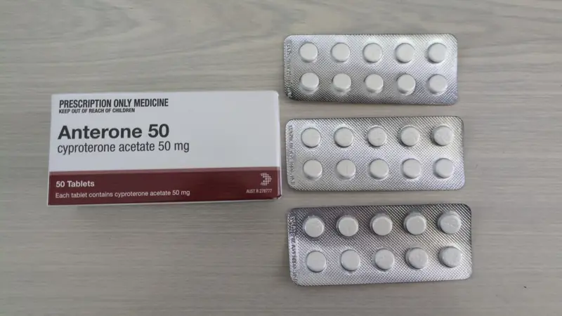 Blister packs of tablets beside their box
