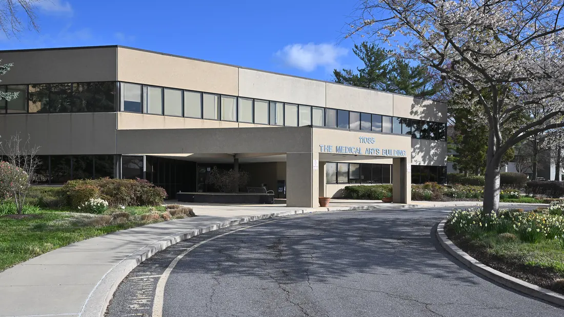 The exterior of an older community hospital building