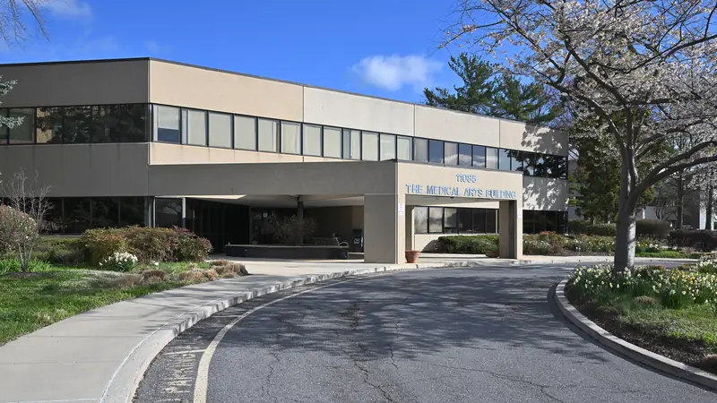 The exterior of an older community hospital building