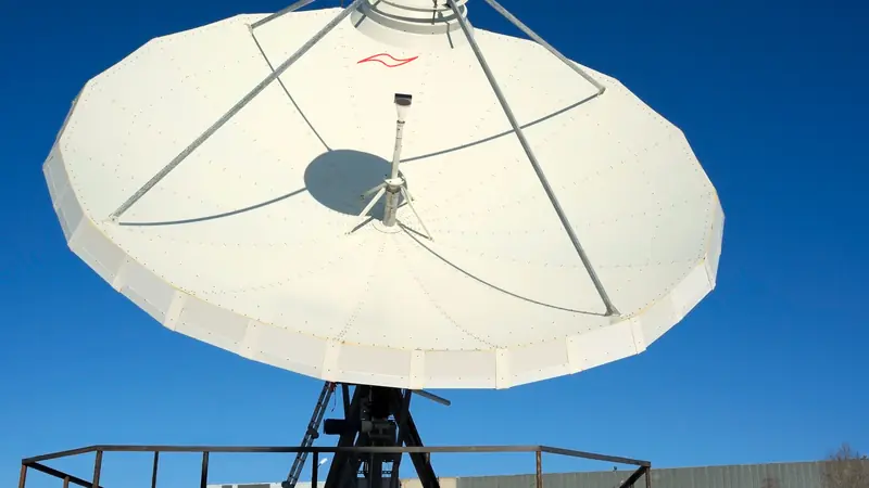 A large satellite dish pointed at the sky